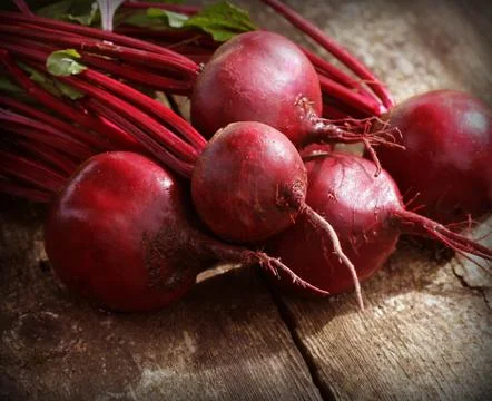 Fresh beetroot on rustic wooden background. Harvest vegetable cooking concept Stock Photos