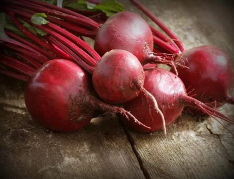 Fresh beetroot on rustic wooden background. Harvest vegetable cooking concept Stock Photos