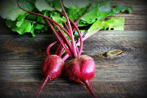 Fresh beetroot on rustic wooden background. Harvest vegetable cooking concept Stock Photos