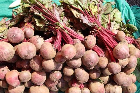 Fresh Beetroot With Stem And green Leaves Arranged On Vegetable Market Stock Photos