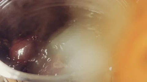 Fresh beets are boiled in the pot. Macro background. Top view, lens distortion Stock Footage 233107394
