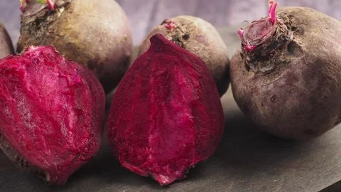 Fresh beets reveal their vibrant crimson hearts Stock Footage 338320067