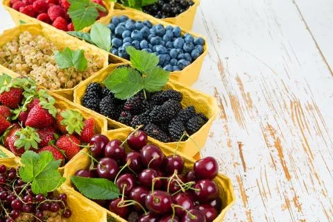 Fresh berries in baskets Stock Photos