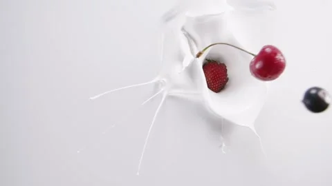 Fresh berries falling down to the milk Stock Footage 171887730