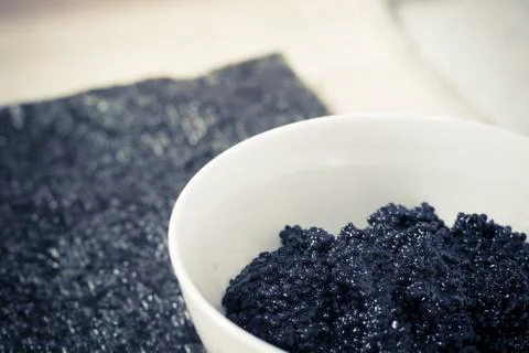 Fresh black caviar in a bowl to make sushi and fish dishes Stock Photos