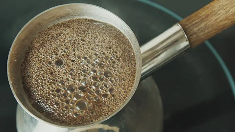Fresh black coffee boiling in the pot 1 Stock Footage 264859968