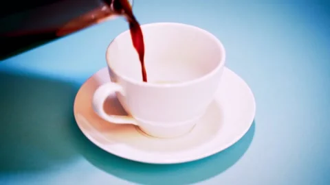 Fresh black coffee poured into an empty cup Stock Footage 149996324