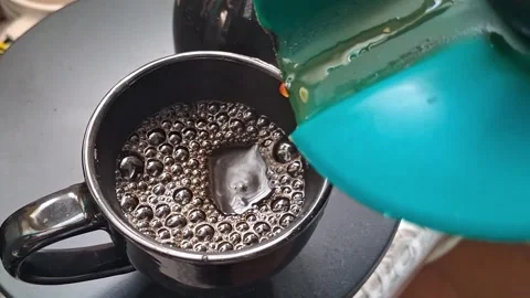 Fresh black coffee pouring into ceramic mug video motion clip Video stock 339248216