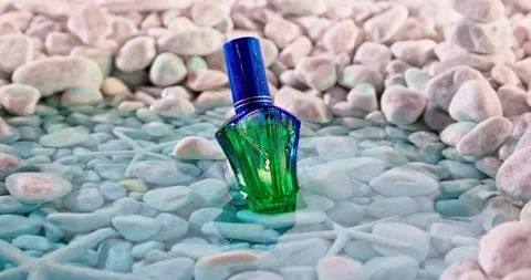 Fresh blue perfume in environment of white stones and sea. Stock-Footage 335599841