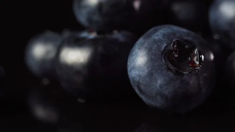 Fresh blueberries on black background, macro shot. Healthy food concept. Stock Footage 137183648
