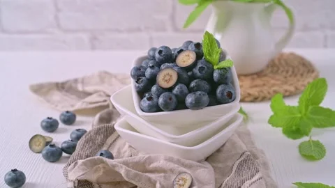Fresh Blueberries in a Square Bowl with Mint Garnish Stock Footage 337801899