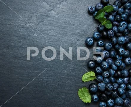 Fresh blueberries on a stone background Stock Photos