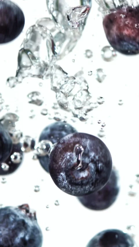 Fresh blueberry fall underwater with bubbles. Filmed is slow motion 1000 fps Stock Footage 335292206