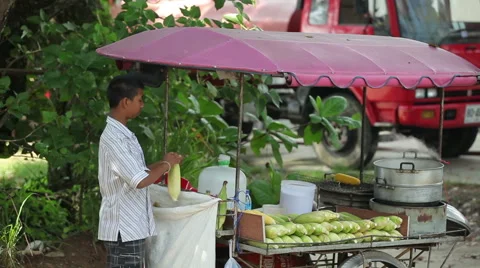 Fresh boiled and roasted corn is beach of Phuket, Thailand Stock Footage 64327272