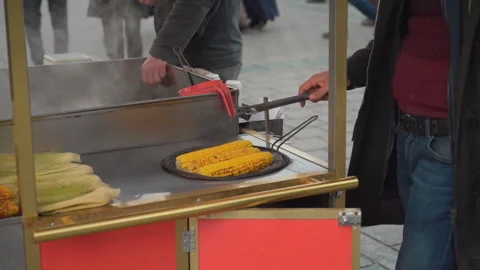 Fresh boiled and roasted corn is famous street food of Istanbul Stock Footage 146883155