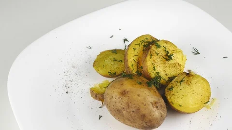 Fresh boiled potatoes.One serving,on a white plate. Stock Footage 127695431