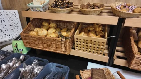 Fresh bread and buns assortment at hotel breakfast buffet Stock Footage 336313083