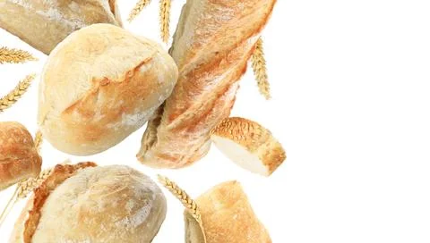 Fresh bread and spikes falling on white background. Banner design with spac.. Stock Photos