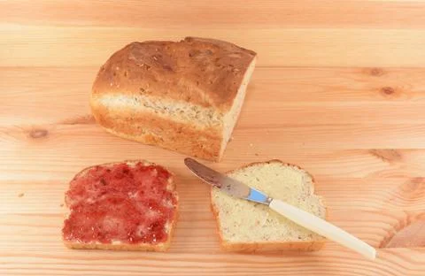 Fresh bread and two slices Stock Photos
