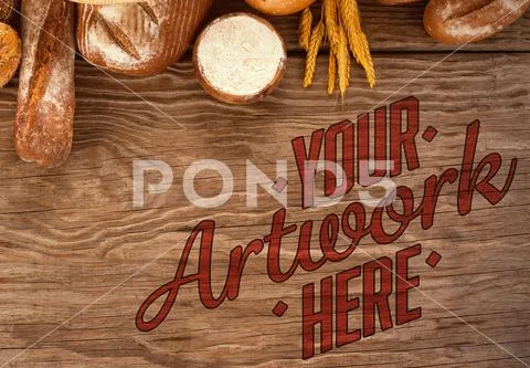 Fresh bread and wheat grains on wood PSD Template