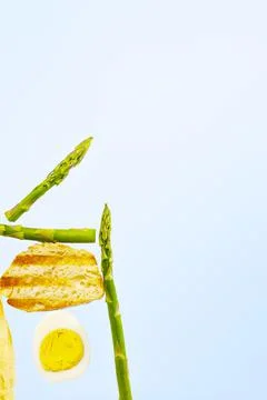 Fresh Bread, Asparagus and Egg. Ingridients for Breakfast. Equilibrium floati Stock Photos