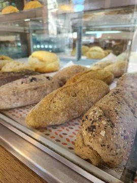 Fresh bread in a bakery display. Stock Photos