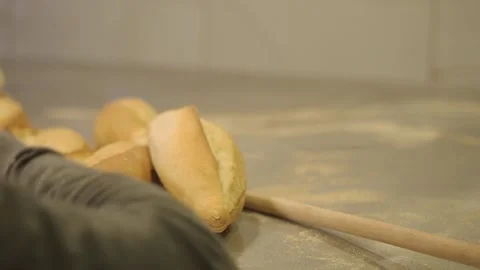 Fresh bread baking in a busy bakery kitchen Stock Footage 332886422