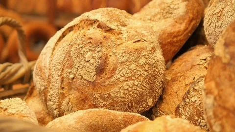 Fresh bread baking in a local bakery during the morning Stock Footage 332452075