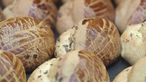 Fresh bread baking at local bakery in morning hours Видео 337446059