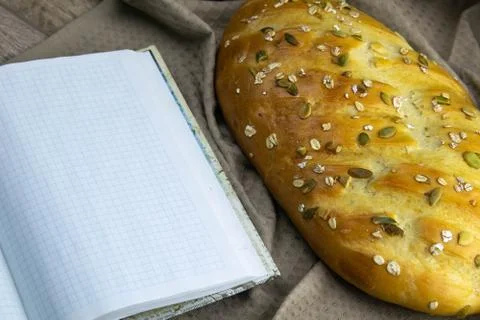 Fresh bread with blank notebook space for your text Stock Photos