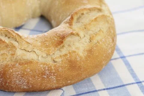 Fresh bread on the checkered towel. Close up 스톡 사진