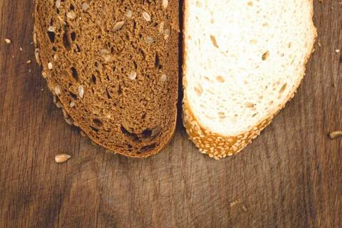 Fresh bread on a cutting board. Stock Photos