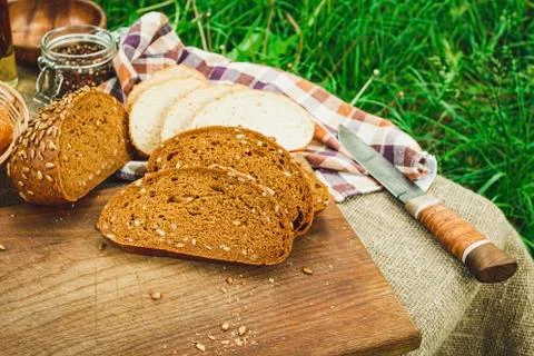 Fresh bread on a cutting board. Stock Photos