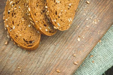 Fresh bread on a cutting board. Stock Photos