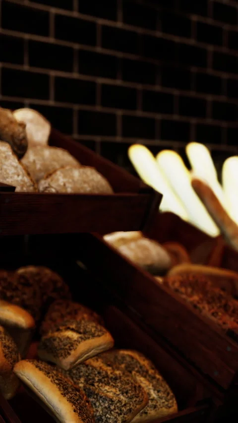 Fresh bread display at bakery in the early morning light Stock Footage 340632922