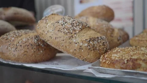 Fresh bread on display at local bakery in the morning Stock Footage 340245221