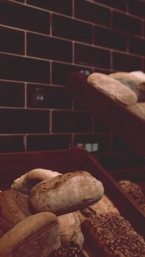 Fresh bread displayed at a bakery in the evening Stock Footage 340643857