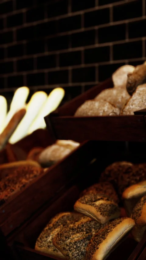 Fresh bread displayed in baskets at a bakery during the evening hours Stock Footage 339105457