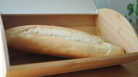 Fresh bread displayed in wooden basket on table Stock Footage 344917337