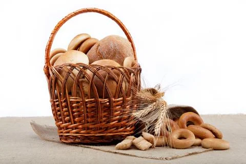 Fresh bread with ears of wheat on the canvas. Stock Photos
