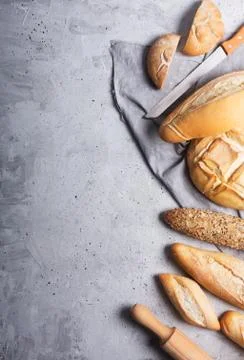 Fresh bread on a gray concrete background. Top view with copy space 스톡 사진