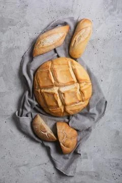 Fresh bread on a gray concrete background. Top view with copy space 写真素材