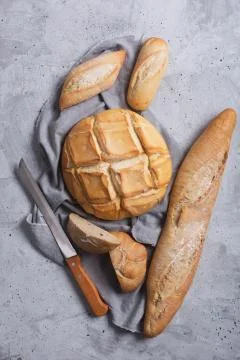 Fresh bread on a gray concrete background. Top view with copy space 写真素材