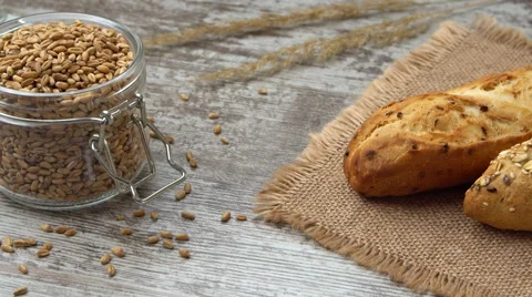 Fresh bread on the kitchen table. Healthy eating and traditional bakery concept Video stock 67724975