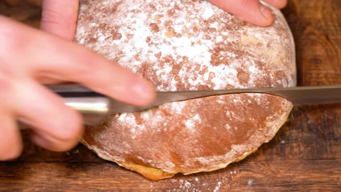 Fresh bread loaf cut into slices Stock Footage 252458978