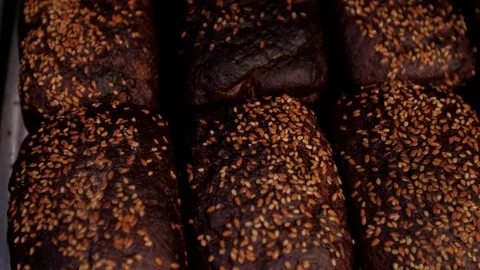 Fresh bread loafs lying on the shelf. Stock Footage 80855662