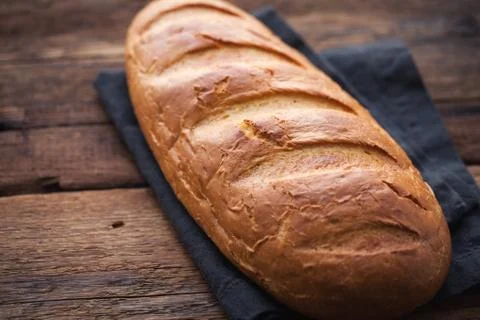 Fresh bread on a old rustic wooden table Stock Photos