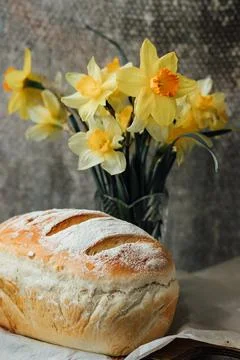 Fresh bread only from the oven, cools down on parchment paper, near beautiful Stock Photos
