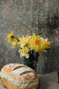 Fresh bread only from the oven, cools down on parchment paper, near beautiful Foto stock