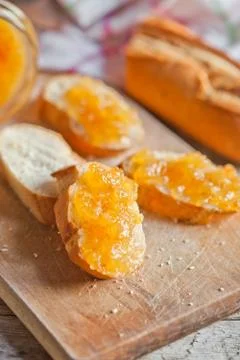 Fresh bread with orange jam Stock Photos